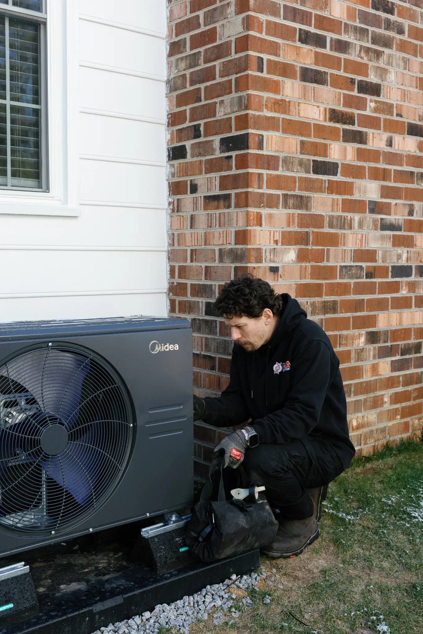 HVAC technician repairing a heat pump in Richmond, VA